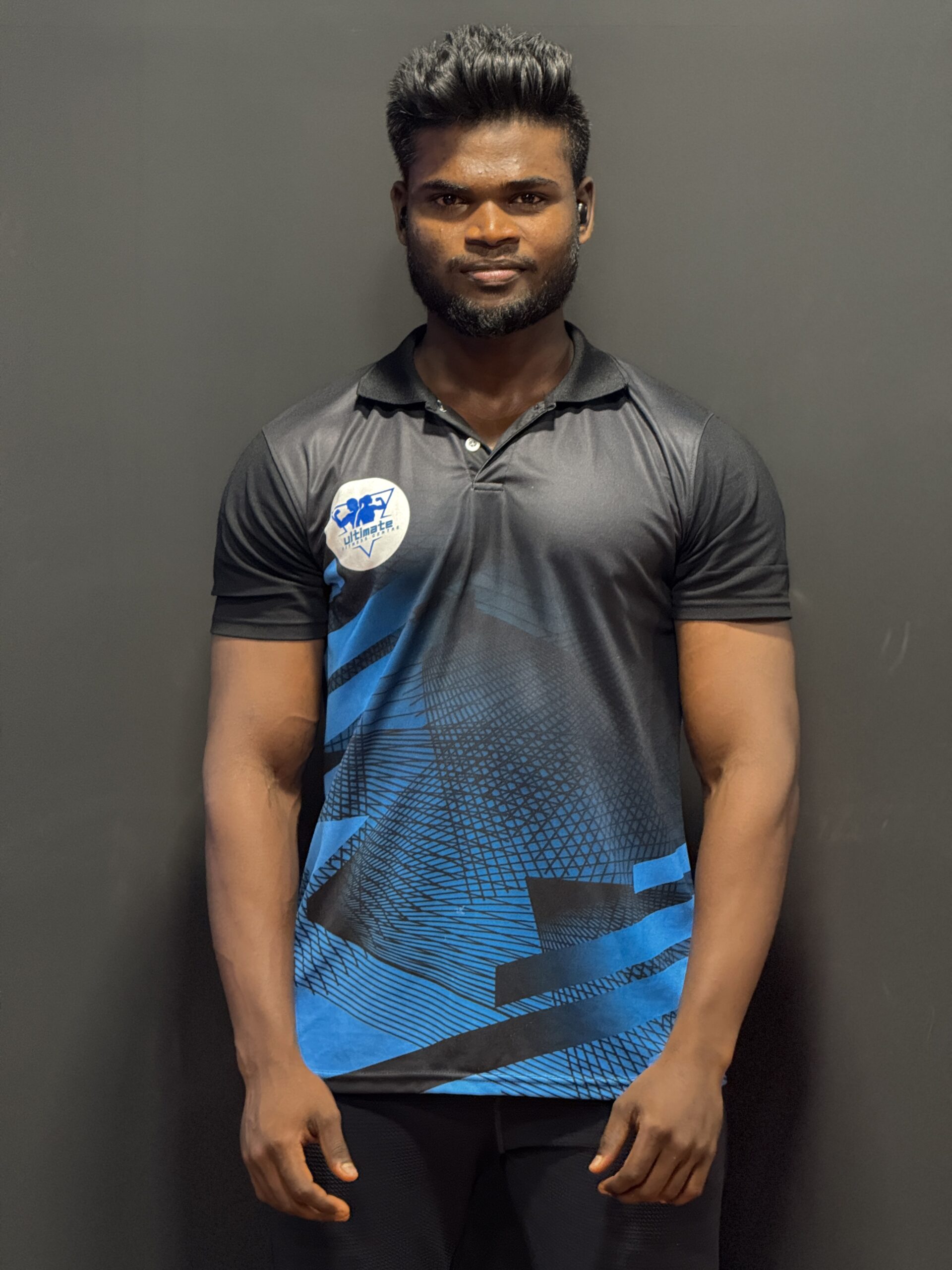 Certified gym trainer at Ultimate Fitness Centre, Adyar, guiding members through strength training